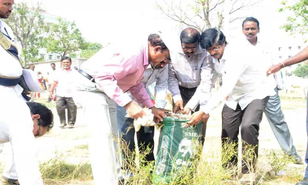 Collector M V Reddy personally clears piled-up garbage at Medchal