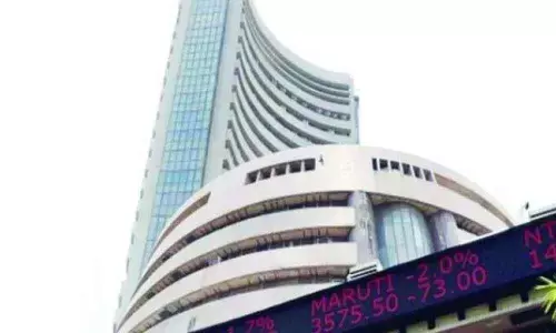 Markets end in red as global woes weigh