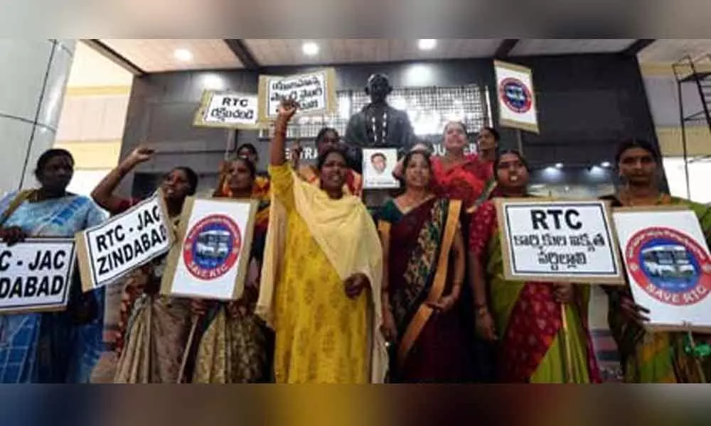 RTC women employees stage mute protest in Hyderabad