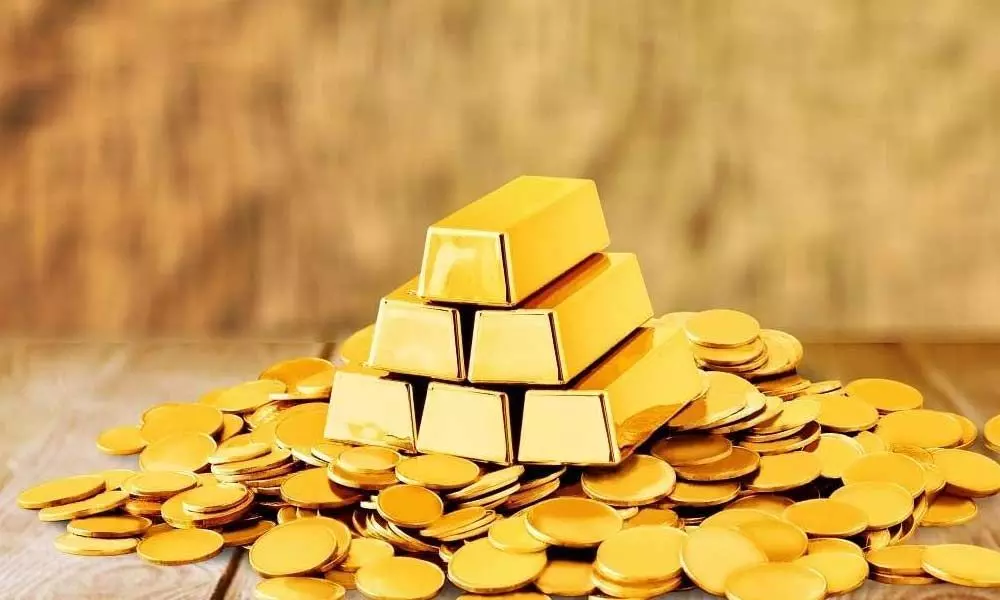 Gold declines Rs 166 on weak global trend