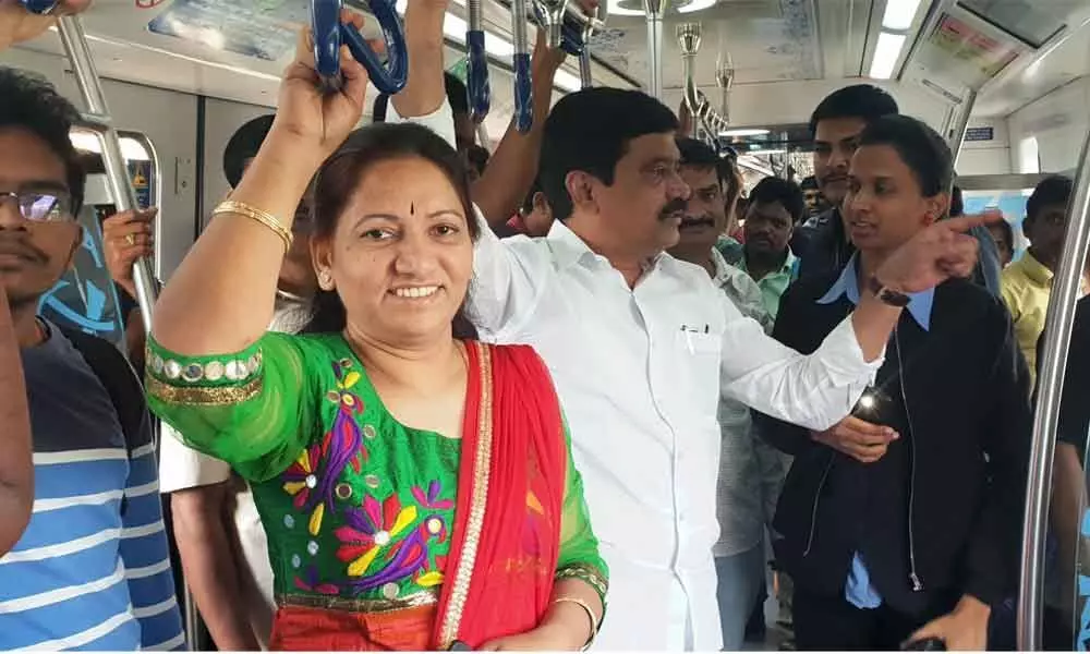 Minister Vemula Prashanth Reddy travels in Metro train, takes feedback from commuters