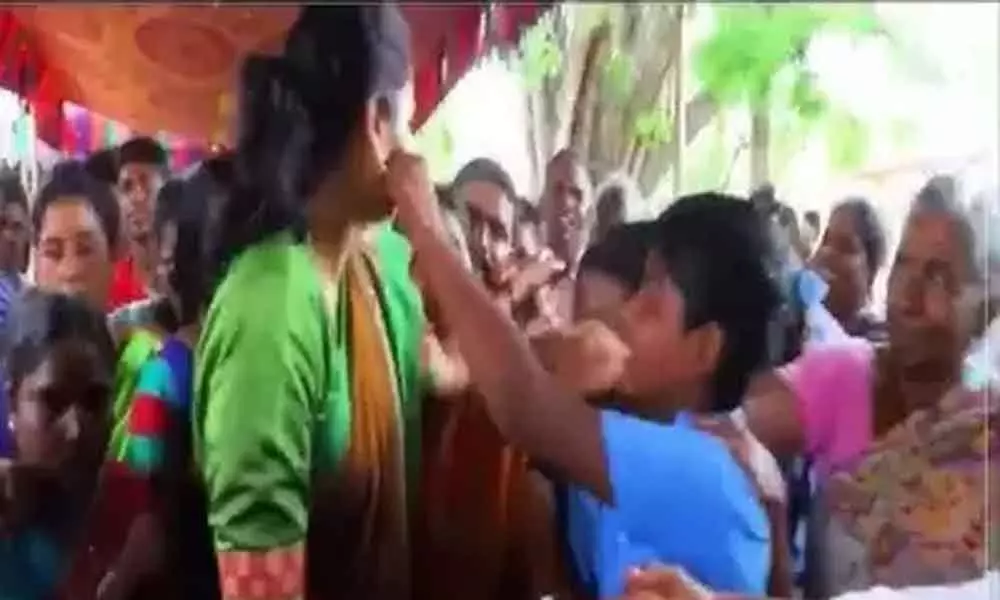 A school boy kisses YSRCP MLA Vidadala Rajini: Video goes Viral