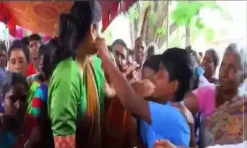 A school boy kisses YSRCP MLA Vidadala Rajini: Video goes Viral