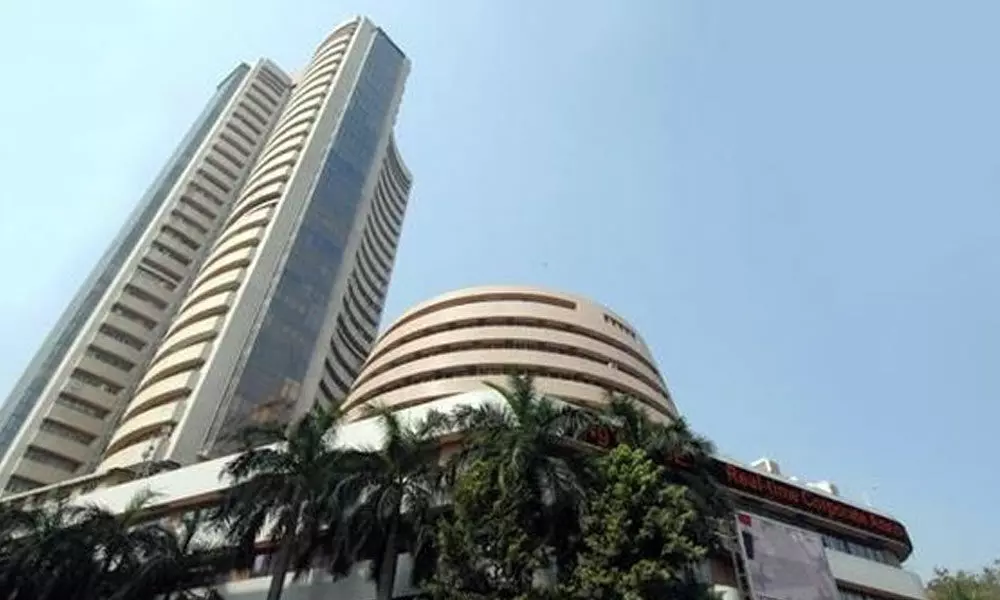 Sensex, Nifty end lower after hitting record high