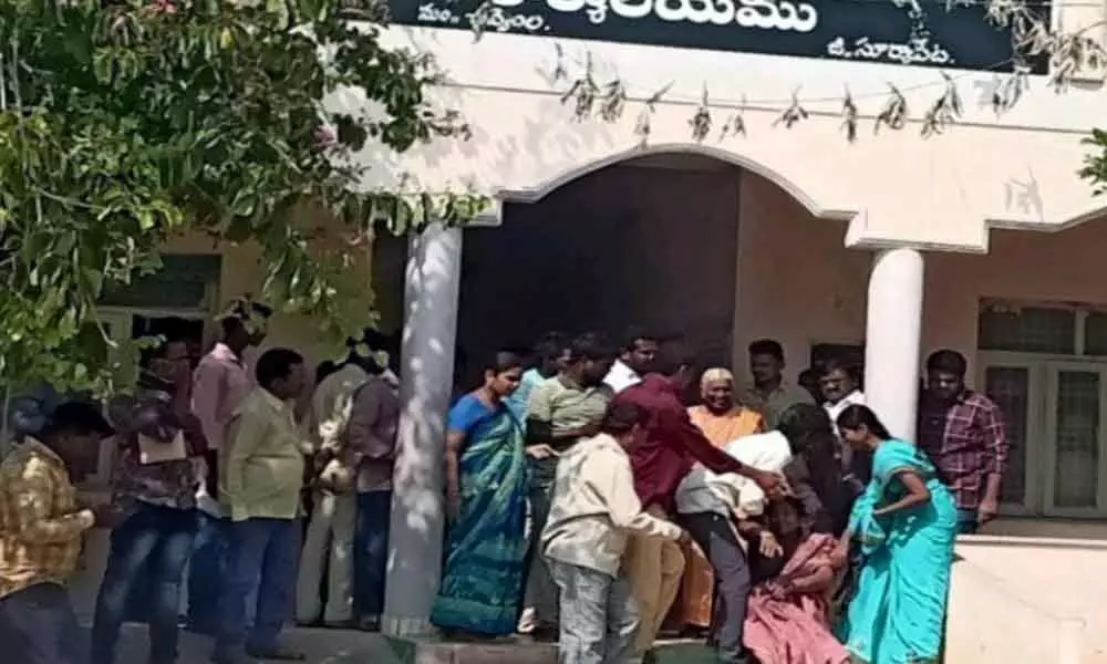 Suryapet: Woman attempts suicide at Chivemla Tahsildars office demanding land