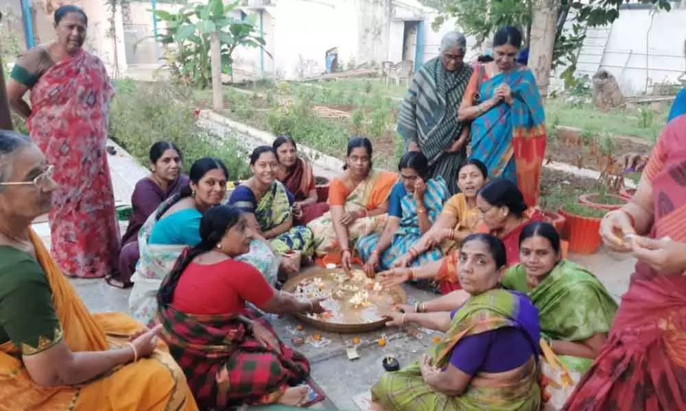 Women perform Tulsi puja at Ramalayam temple in Nizamabad