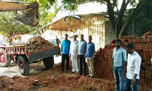 Corporator Janakirama Raju inspects road repairs at Hydernagar division
