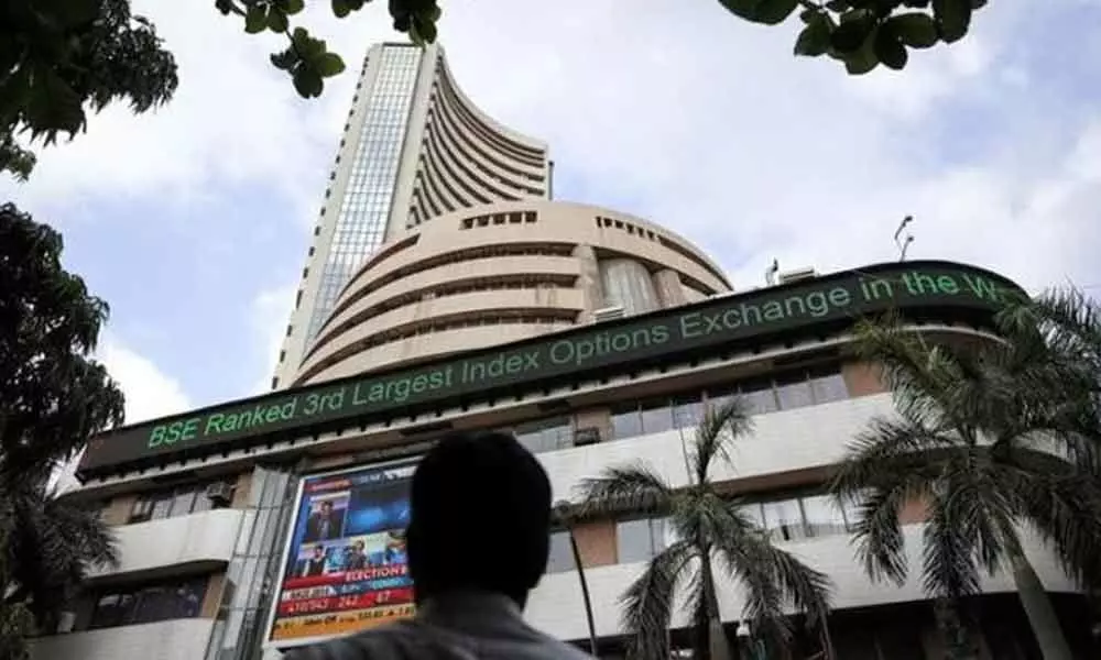 Markets end flat amid volatile trading