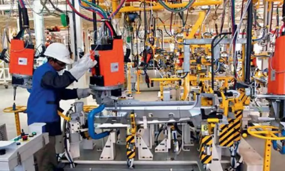 Manufacturing sector activity inches up on new orders