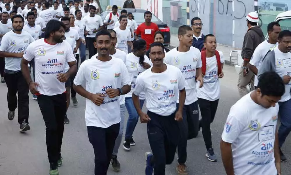 Run held on eve of  World Disability Day at Peoples Plaza