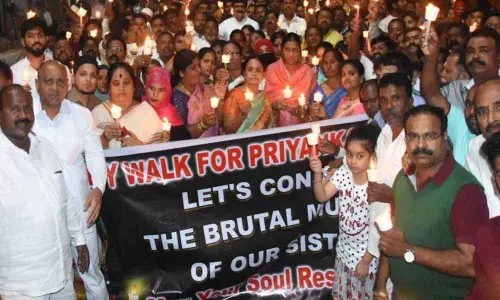 TRS activists hold candle rally at Malkajgiri