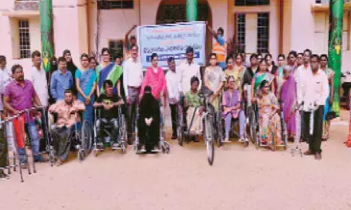 Wheelchairs distributed to persons with disabilities at Amberpet municipal grounds