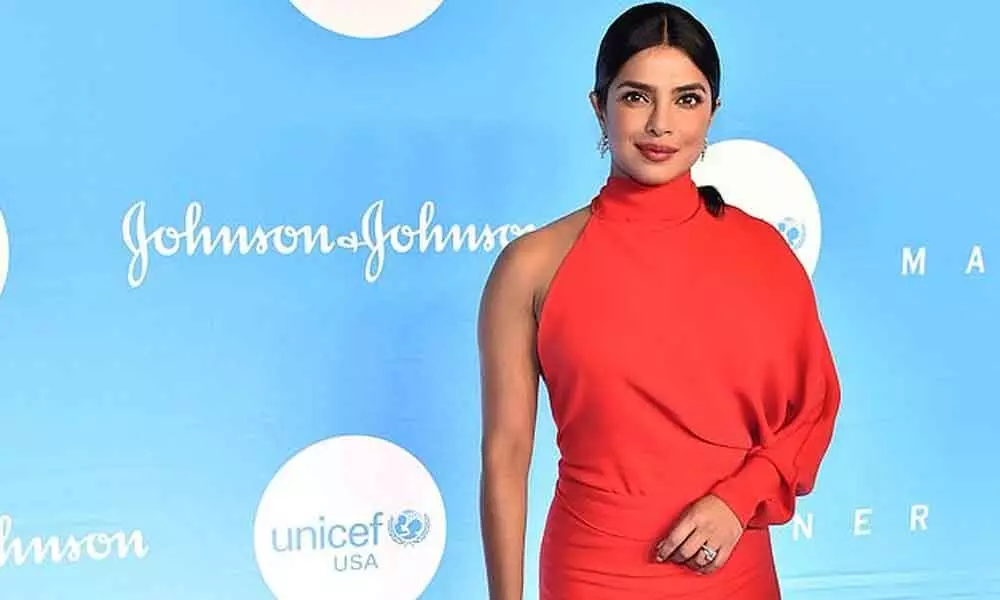 The Diva Priyanka Chopra paints NYC in figure hugging Red Gown with one sleeve