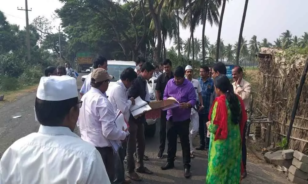 District Collector R Muthyala Raju inspects govt land for housing scheme