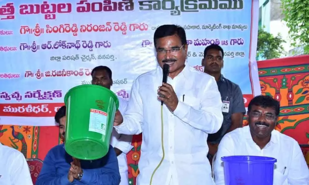 Minister Singireddy Niranjan Reddy distributed bins to colony residents in Wanaparthy