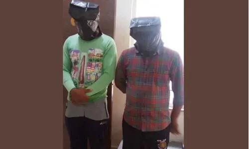 Two held for molesting a woman in Chittoor district