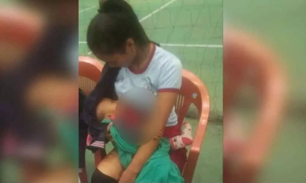 Volley Ball player breastfeeds child on field in between game: Proves Breastfeeding can happen anywhere