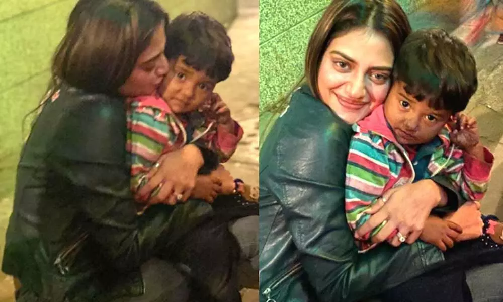 Nusrat Jahan shares pictures on Instagram with a baby boy selling balloons. Internet loves it
