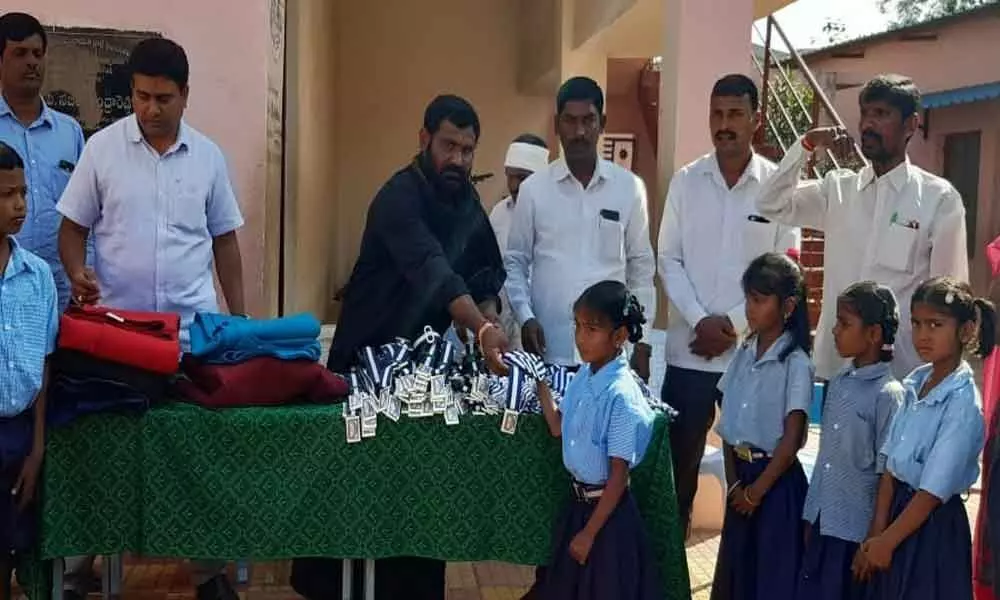 Shankarpally: Sarpanch Swapna Mohan and MPTC D Dyakar Reddys gesture to students