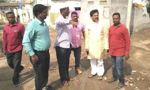 Corporator Akula Narsinga Rao inspects CC road at Malkajgiri division