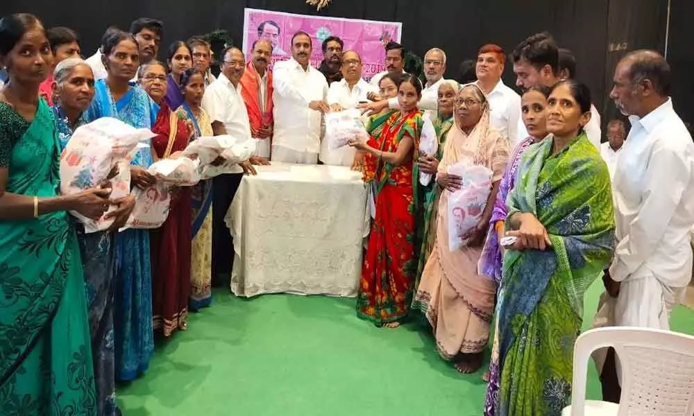 MLA Arekapudi Gandhi distributes clothes to Christians