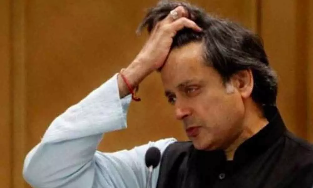 Shashi Tharoor absconds court hearing, receives an arrest warrant