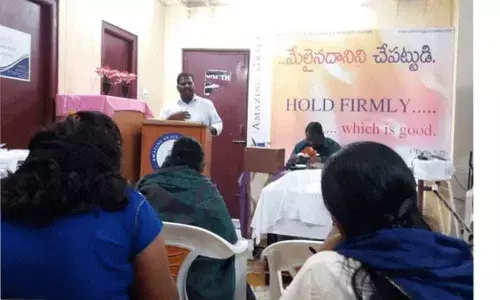 Christmas gifts presented to poor at Baptist Church in Raghavendra Nagar