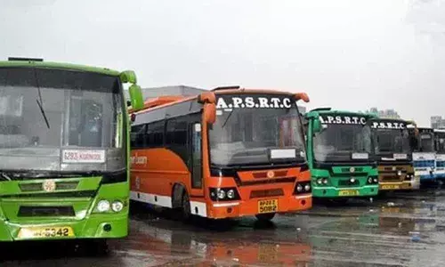 APSRTC employees conduct a rally in Vijayawada against private travels
