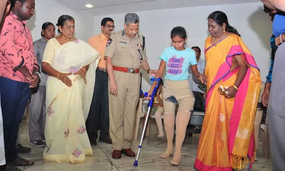 Vijayawada police chief Dwaraka Tirumala Rao distributes artificial limbs