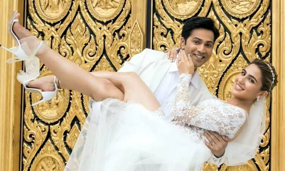 Varun Dhawan and Sara Ali Khan pose in a white wedding dress, the duo will be seen together in Coolie No. 1