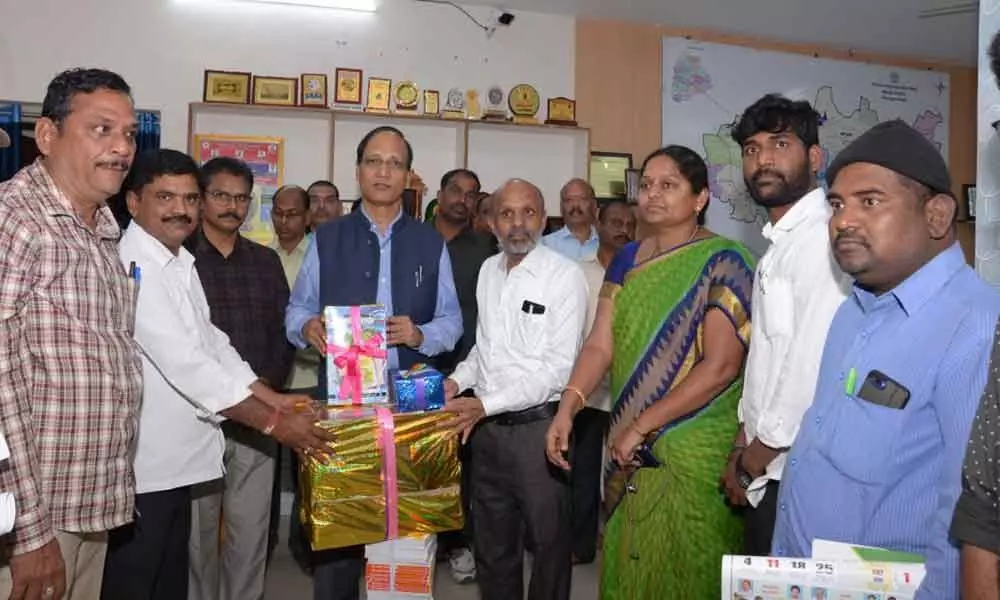 Medak: Books gifted to Collector Dharma Reddy, Joint Collector Nagesh