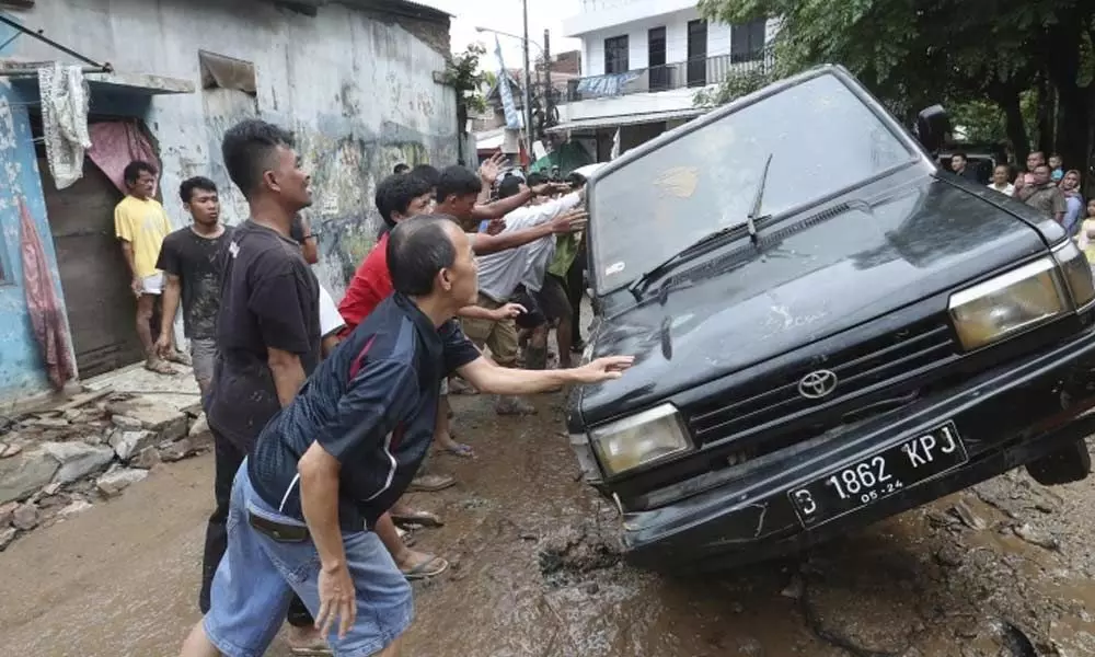 Indonesia flood rescuers hunt for missing after 43 killed