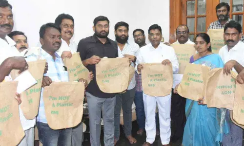 Nama distributes cloth bags in Khammam