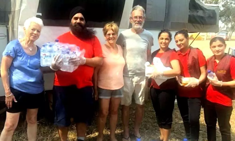 Amid raging bushfires in Australia, Indian couple works overtime by providing food to victims