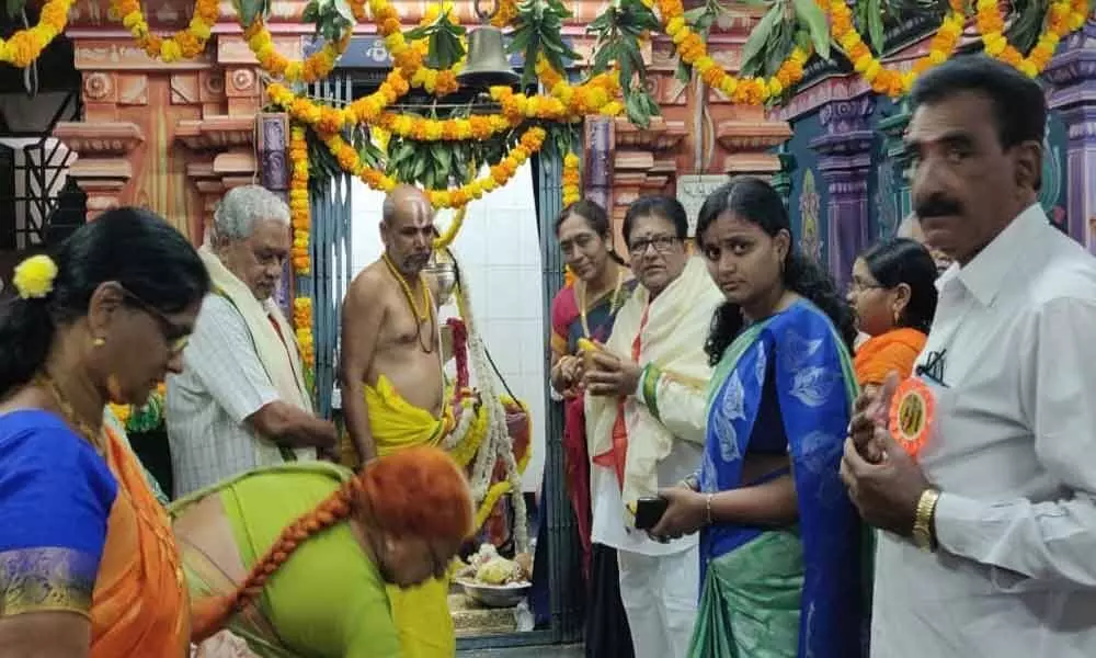 Corporator Janakirama Raju performs puja in temples