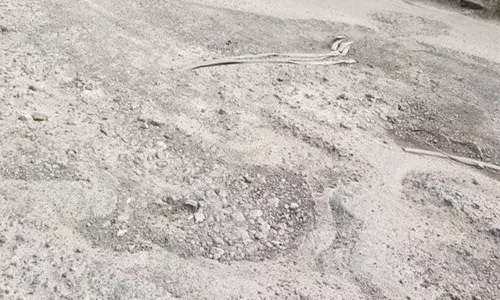 Bumpy ride as road full of potholes