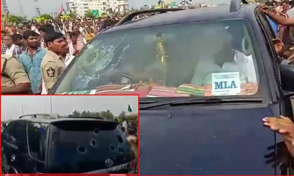 Protestors attack on YSRCP MLAs vehicle on National Highway at Pedakakani
