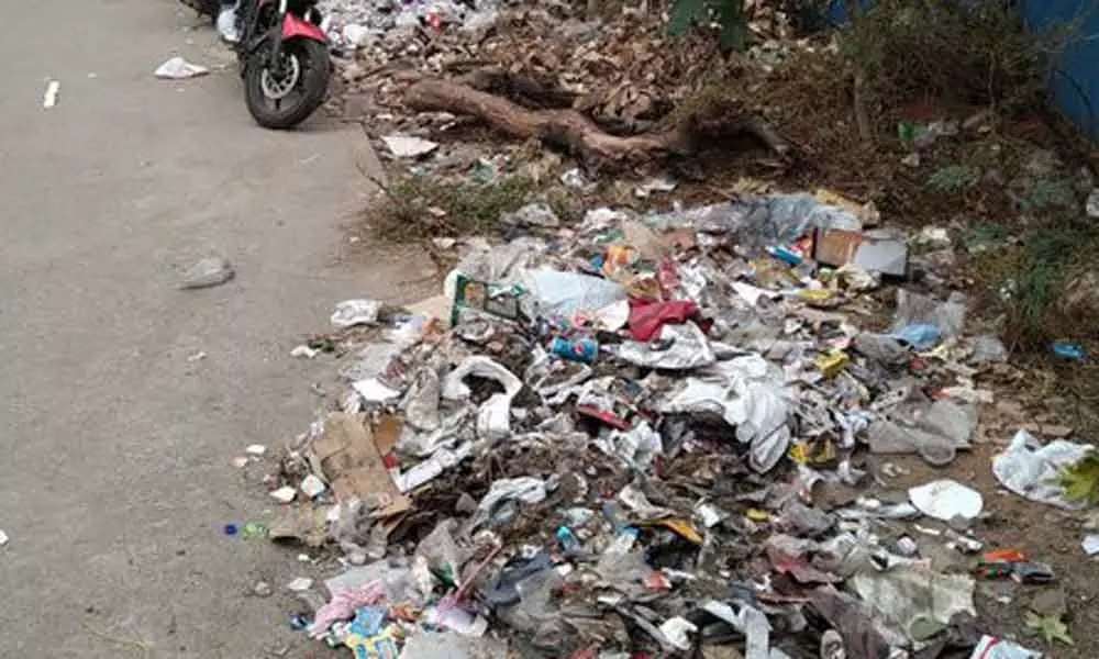 Hi-Tec City main road littered with garbage