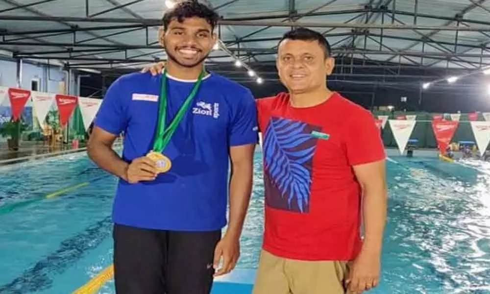 Karimnagar youth wins silver medal in swimming competitions