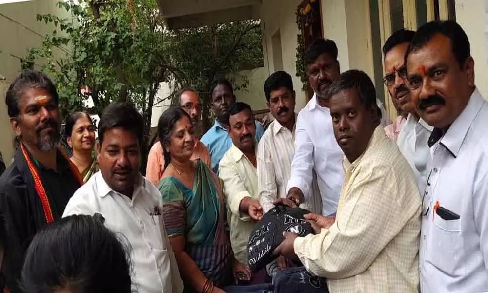 Mynampalli Hanumanth Rao Seva Dal distributes sweaters to students
