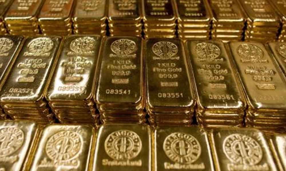 Gold prices drop marginally