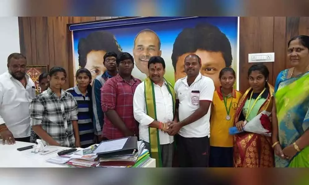 Minister Velampalli Srinivasa Rao felicitates national wrestling players in Vijayawada