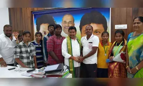 Minister Velampalli Srinivasa Rao felicitates national wrestling players in Vijayawada