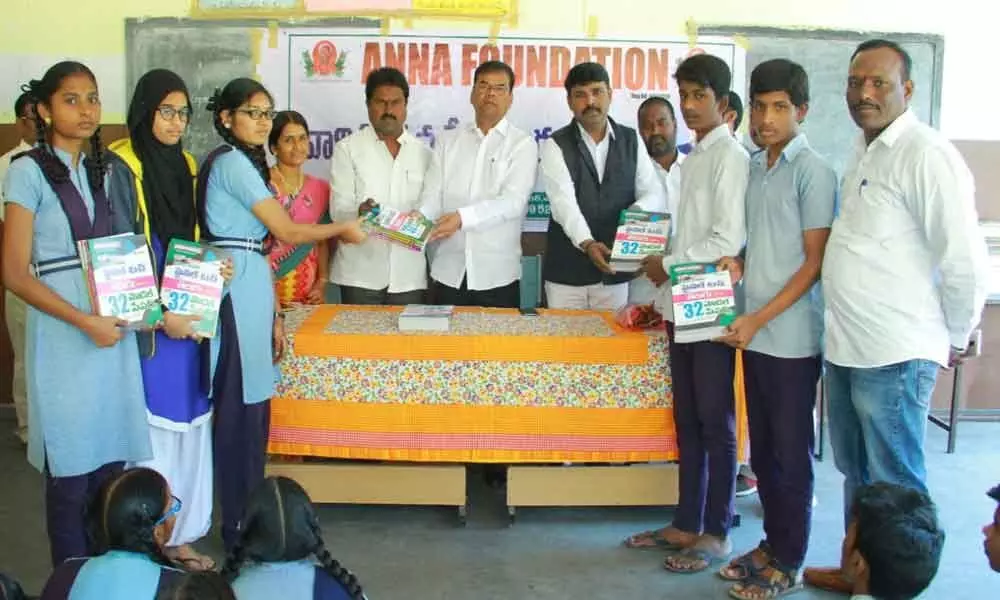 MLA Kaleru Venkatesh distributes study material to students