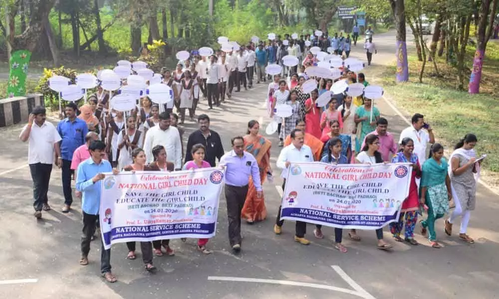 Guntur Acharya Nagarjuna University students take out a rally on National Girl Child Day