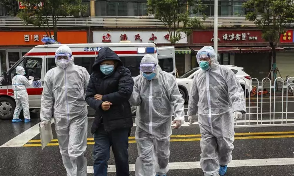 Three Japanese evacuated from Wuhan have new coronavirus