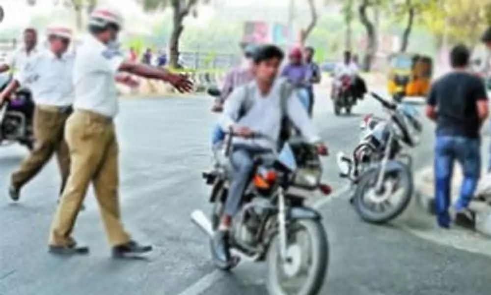 Hyderabad: Homeguard thrashed for clicking photo of motorist riding without helmet Hyderabad: Homeguard thrashed for clicking photo of motorist riding without helmet