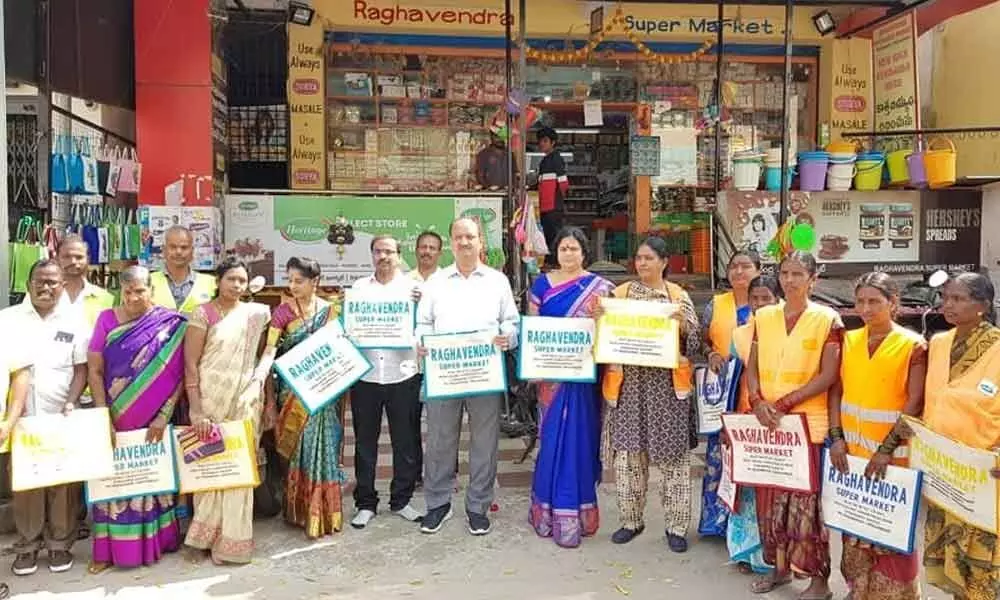 Corporator Lakshmi Prasanna Rammohan Goud distributes jute bags