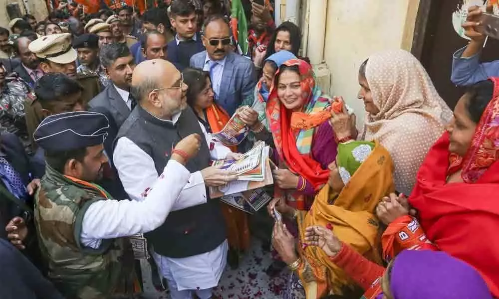 Shah, Nadda on Door to door campaigning in national capital