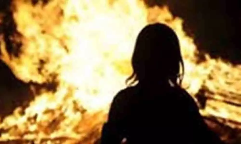 Teacher battles for life after stalker sets her ablaze